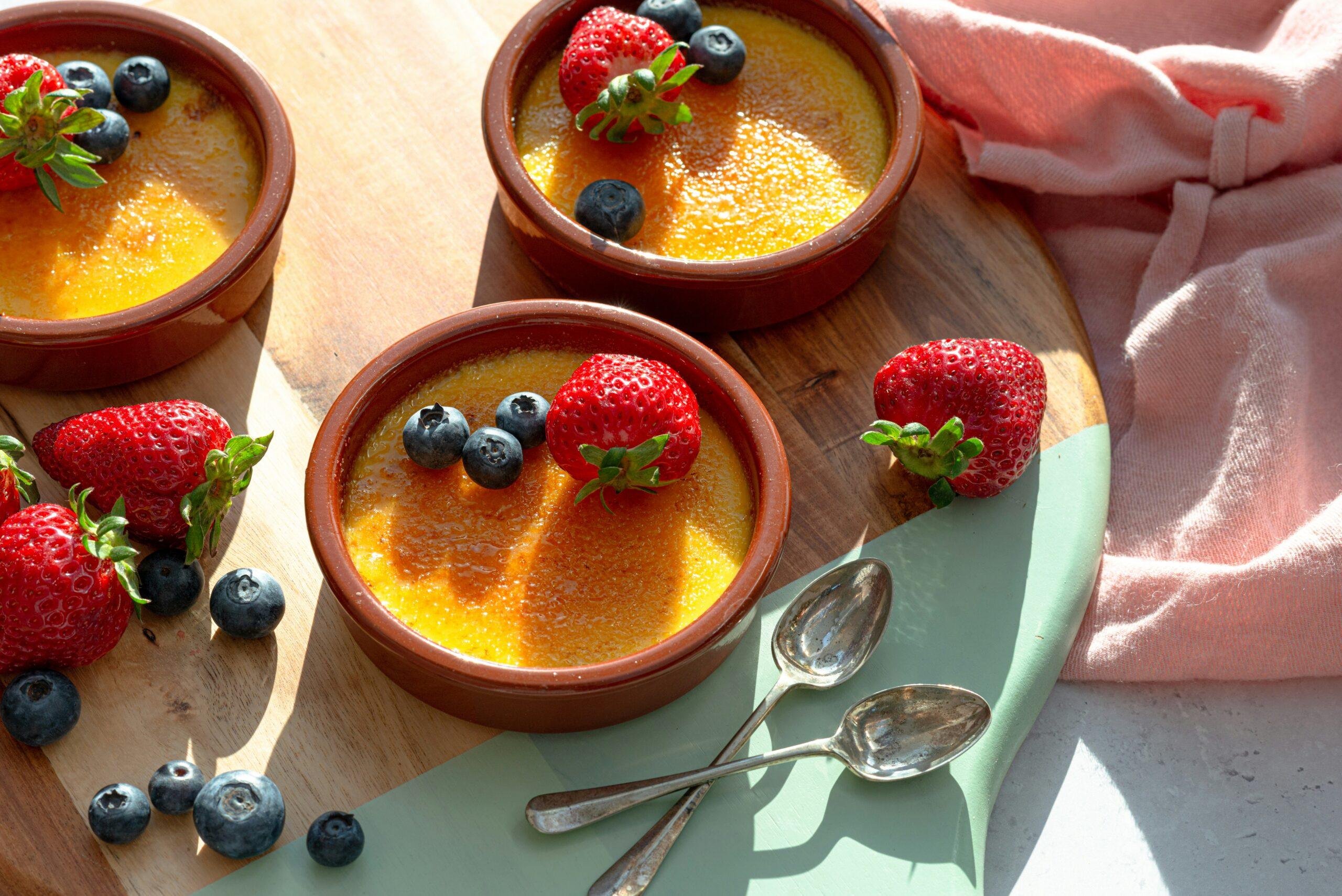 french crème brûlée dessert with strawberry and blueberry