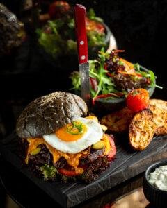 Burger Black Bun With Fried Egg Potatoes 240x300
